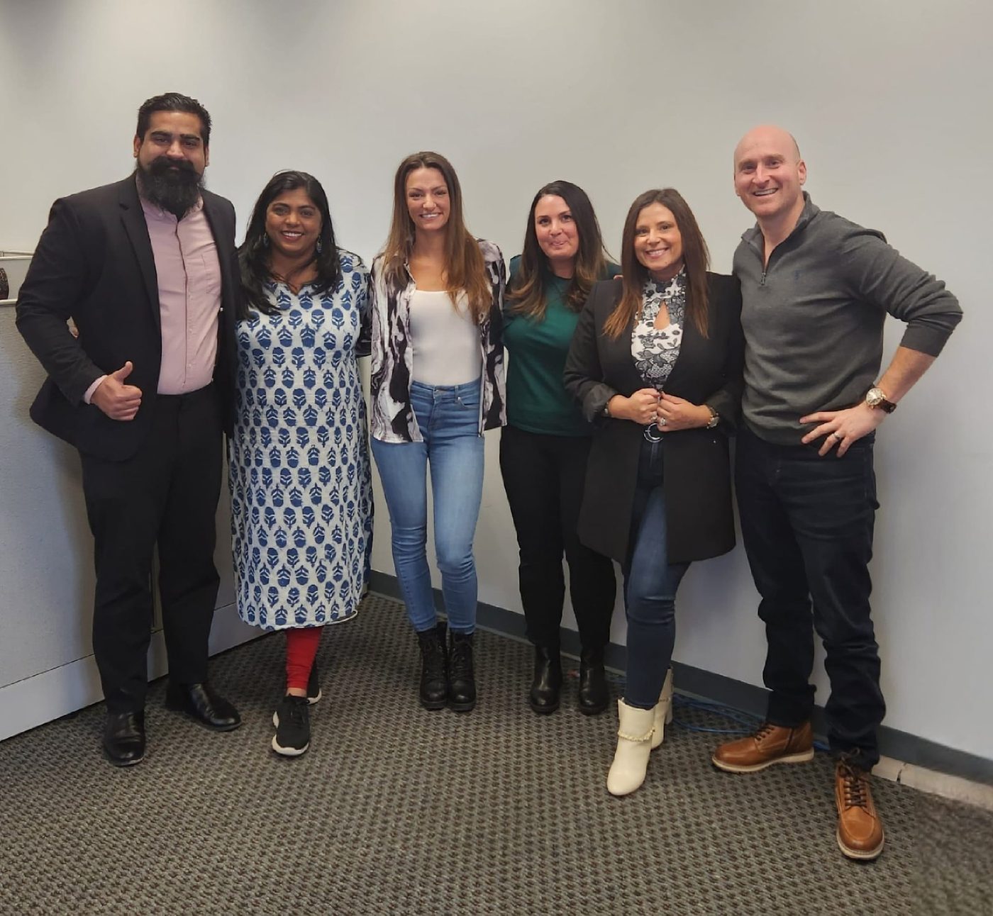 Six members of the GRSCorp team standing together for a group photograph